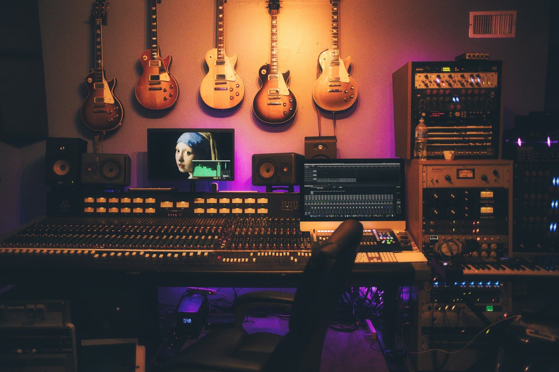 Recording studio with a microphone and mixing desk